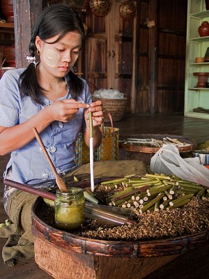 Along Inle Lake, young women work long hours rolling tobacco leaf